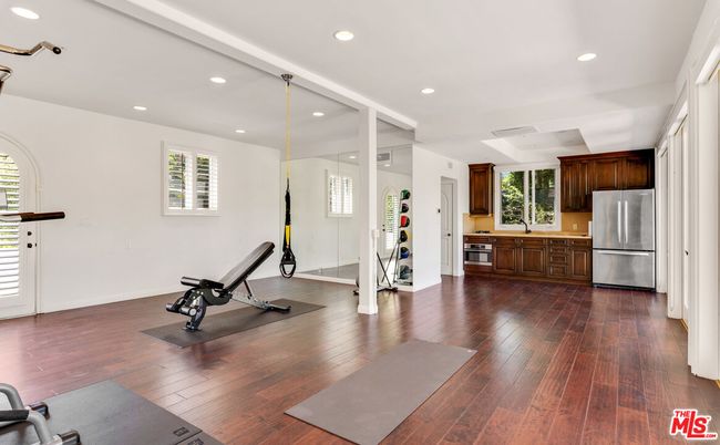 Fitness Equipment, Interior, Kitchen, Recessed Lighting, Stainless Steel Appliances, Wood Texture Flooring