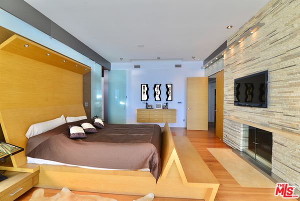 Bedroom, Fireplace, Interior, Recessed Lighting, Stone Walls, Wood Texture Flooring