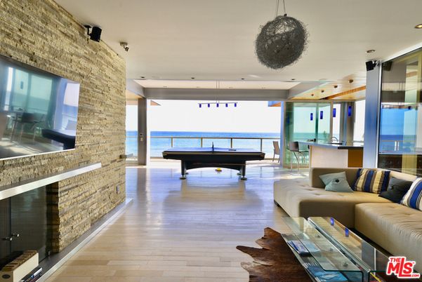 Billiard Table, Fireplace, Game Room, Interior, Living room, Pendant Lights, Recessed Lighting, Stone Walls, Water, Wood Texture Flooring