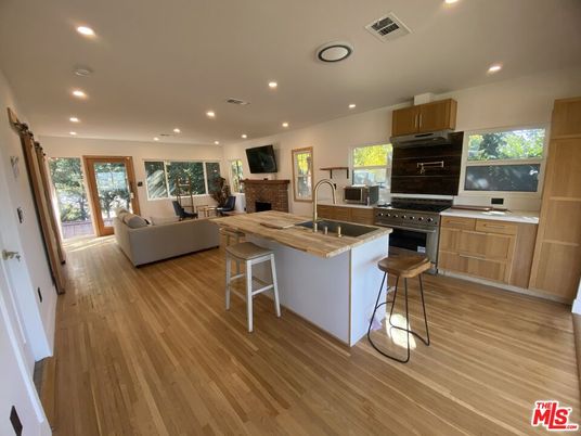 Fireplace, Interior, Kitchen, Living room, Recessed Lighting, Stainless Steel Appliances, Wood Texture Flooring
