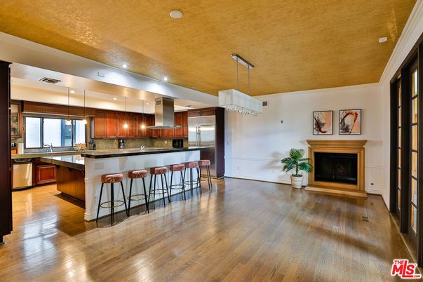Fireplace, Interior, Kitchen, Pendant Lights, Recessed Lighting, Stainless Steel Appliances, Wood Texture Flooring