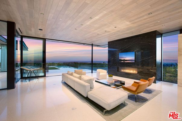 Fireplace, Interior, Living room, Marble Walls, Recessed Lighting, Water, Wooden Ceilings