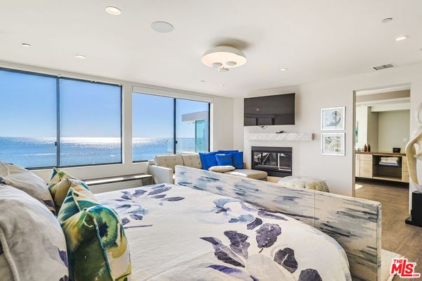 Bedroom, Fireplace, Interior, Recessed Lighting, Water, Wood Texture Flooring