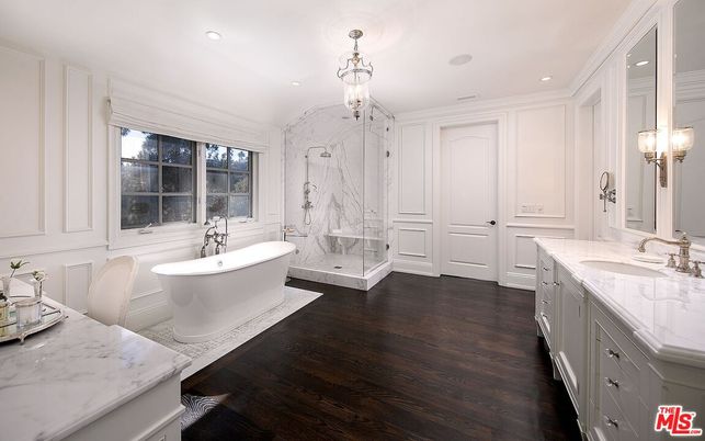 Bathroom, Dual Sink Vanities, Free Standing Baths, Glass Shower, Interior, Marble Walls, Recessed Lighting, Wood Texture Flooring