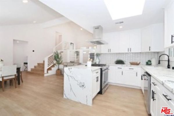 Dining room, Interior, Kitchen, Recessed Lighting, Stainless Steel Appliances, Wood Texture Flooring