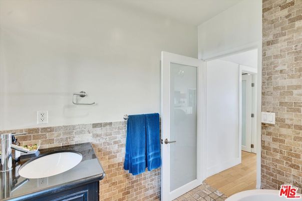 Bathroom, Glass Shower, Interior, Stone Walls, Wood Texture Flooring