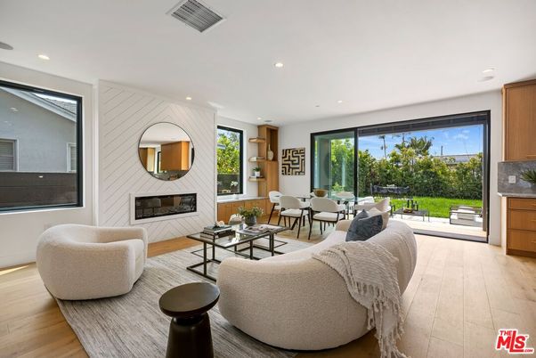 Dining room, Fireplace, Interior, Living room, Recessed Lighting, Wood Texture Flooring