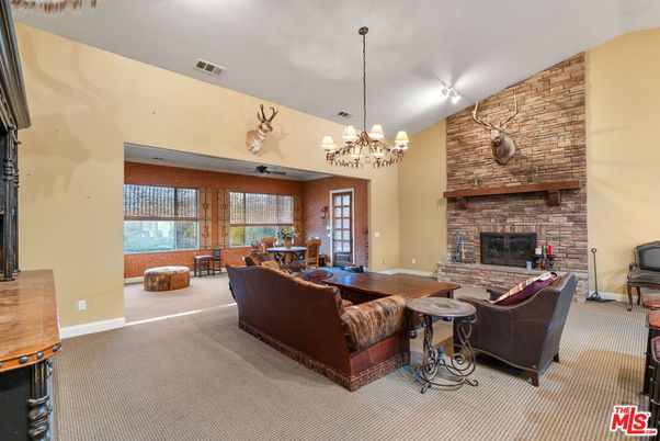 Chandelier, Dining room, Fireplace, Interior, Living room, Stone Walls