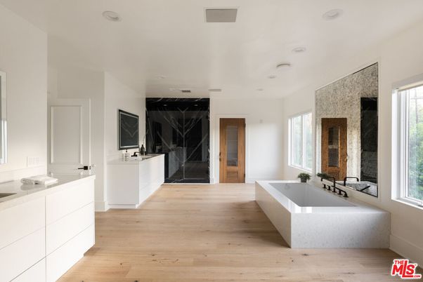 Bathroom, Dual Sink Vanities, Free Standing Baths, Interior, Marble Walls, Recessed Lighting, Wood Texture Flooring