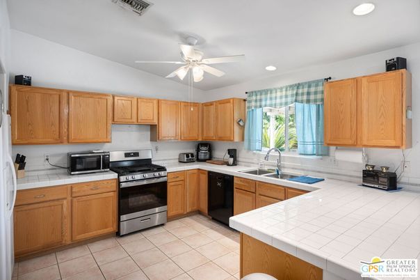 Interior, Kitchen, Recessed Lighting, Stainless Steel Appliances, Tile Countertops