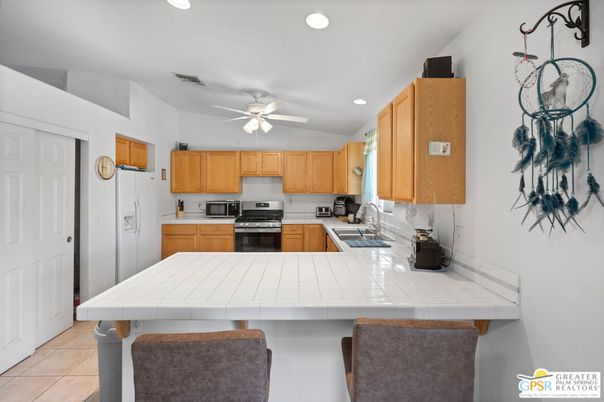 Interior, Kitchen, Recessed Lighting, Stainless Steel Appliances, Tile Countertops
