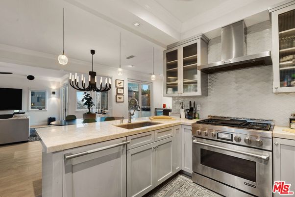 Chandelier, Interior, Kitchen, Living room, Pendant Lights, Recessed Lighting, Stainless Steel Appliances, Wood Texture Flooring
