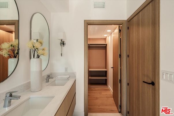 Bathroom, Dual Sink Vanities, Interior, Recessed Lighting, Walk-in Closets, Wood Texture Flooring