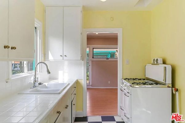 Interior, Kitchen, Recessed Lighting, Tile Countertops, Wood Texture Flooring