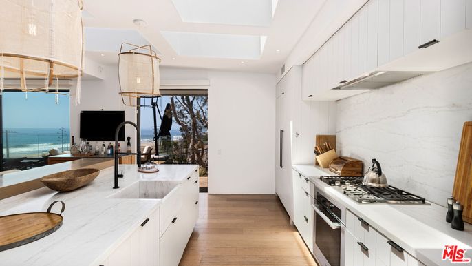 Interior, Kitchen, Marble Walls, Recessed Lighting, Stainless Steel Appliances, Water, Wood Texture Flooring