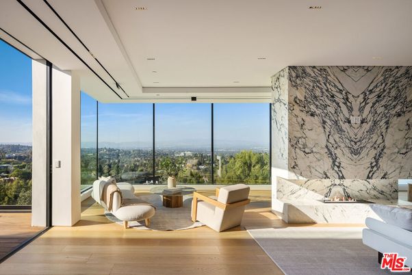 Fireplace, Interior, Living room, Marble Walls, Recessed Lighting, Wood Texture Flooring