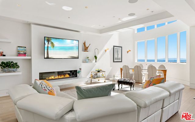 Dining room, Fireplace, Interior, Living room, Recessed Lighting, Water, Wood Texture Flooring