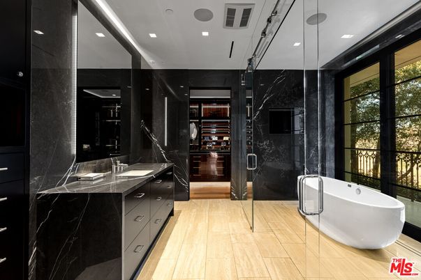 Bathroom, Dual Sink Vanities, Free Standing Baths, Glass Shower, Interior, Marble Walls, Recessed Lighting, Walk-in Closets, Wood Texture Flooring