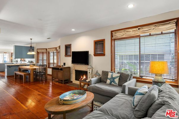 Dining room, Fireplace, Interior, Living room, Pendant Lights, Recessed Lighting, Wood Texture Flooring