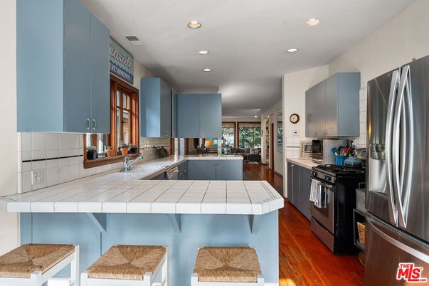Interior, Kitchen, Recessed Lighting, Stainless Steel Appliances, Tile Countertops, Wood Texture Flooring