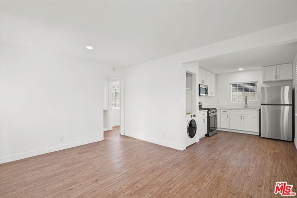 Interior, Kitchen, Recessed Lighting, Washer, Wood Texture Flooring
