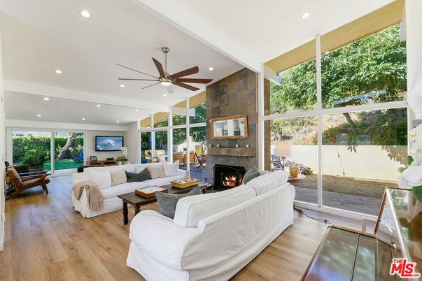 Fireplace, Interior, Living room, Recessed Lighting, Stone Walls, Wood Texture Flooring