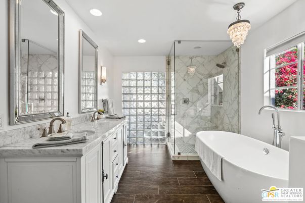 Bathroom, Chandelier, Dual Sink Vanities, Free Standing Baths, Glass Shower, Interior, Marble Walls, Recessed Lighting, Wood Texture Flooring