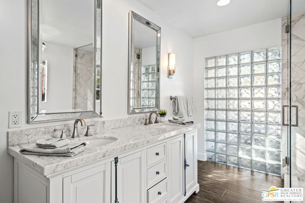 Bathroom, Dual Sink Vanities, Glass Shower, Interior, Marble Walls, Recessed Lighting, Wood Texture Flooring