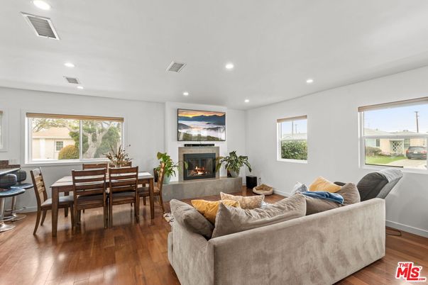 Dining room, Fireplace, Interior, Living room, Recessed Lighting, Wood Texture Flooring