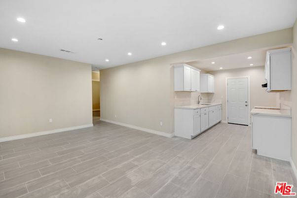 Interior, Kitchen, Recessed Lighting, Washer, Wood Texture Flooring