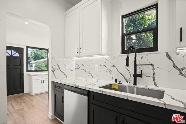 Interior, Kitchen, Marble Walls, Recessed Lighting, Stainless Steel Appliances, Wood Texture Flooring