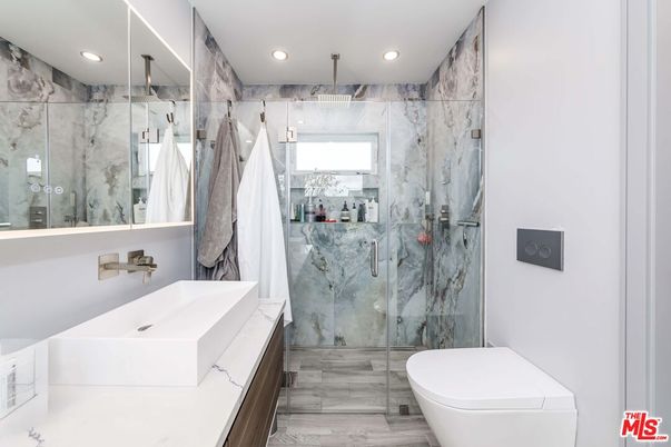 Bathroom, Glass Shower, Interior, Marble Walls, Recessed Lighting, Wood Texture Flooring