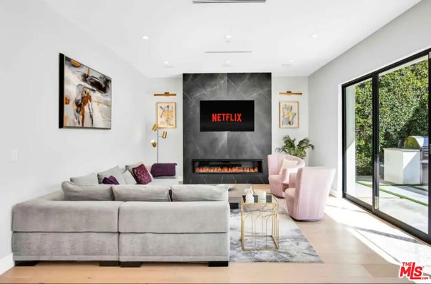 Fireplace, Interior, Living room, Marble Walls, Recessed Lighting, Wood Texture Flooring