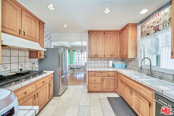 Interior, Kitchen, Recessed Lighting, Tile Countertops, Wood Texture Flooring