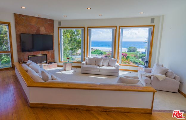 Fireplace, Interior, Living room, Recessed Lighting, Water, Wood Texture Flooring