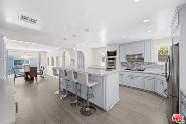 Dining room, Interior, Kitchen, Pendant Lights, Recessed Lighting, Stainless Steel Appliances, Wood Texture Flooring