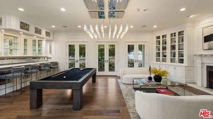 Billiard Table, Fireplace, Game Room, Interior, Living room, Pendant Lights, Recessed Lighting, Wood Texture Flooring