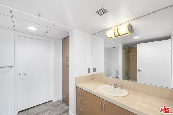 Bathroom, Interior, Recessed Lighting, Tile Countertops, Wood Texture Flooring