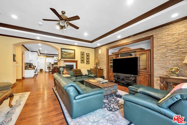 Fireplace, Interior, Living room, Recessed Lighting, Stone Walls, Wood Texture Flooring