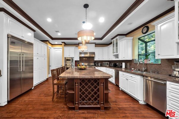 Chandelier, Interior, Kitchen, Pendant Lights, Recessed Lighting, Stainless Steel Appliances, Wood Texture Flooring