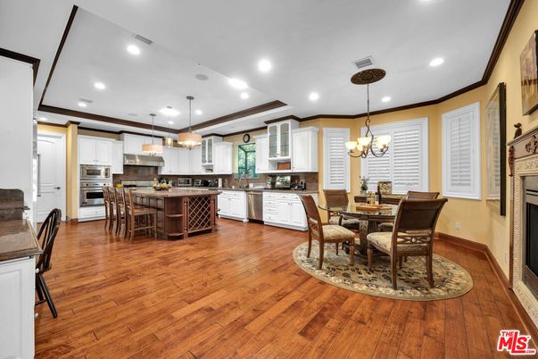 Chandelier, Dining room, Interior, Kitchen, Pendant Lights, Recessed Lighting, Stainless Steel Appliances, Wood Texture Flooring