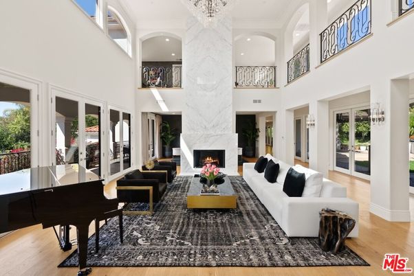 Chandelier, Fireplace, Interior, Living room, Marble Walls, Piano, Recessed Lighting, Wood Texture Flooring