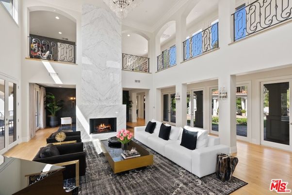 Chandelier, Fireplace, Interior, Living room, Marble Walls, Recessed Lighting, Wood Texture Flooring