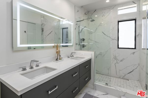 Bathroom, Dual Sink Vanities, Glass Shower, Interior, Marble, Marble Walls, Recessed Lighting