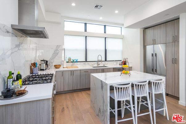 Interior, Kitchen, Marble Walls, Recessed Lighting, Stainless Steel Appliances, Wood Texture Flooring
