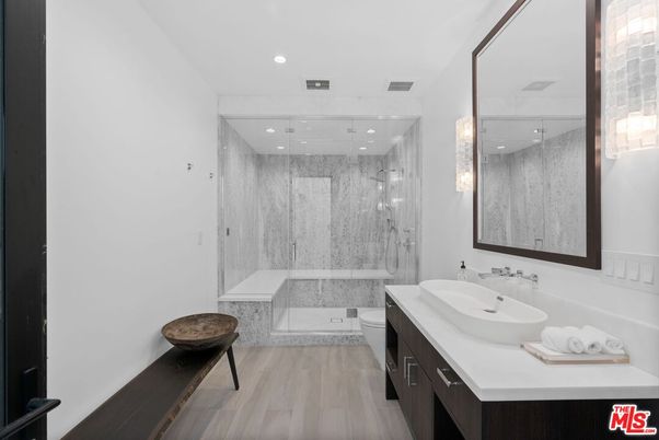 Bathroom, Dual Sink Vanities, Glass Shower, Interior, Marble Walls, Recessed Lighting, Wood Texture Flooring