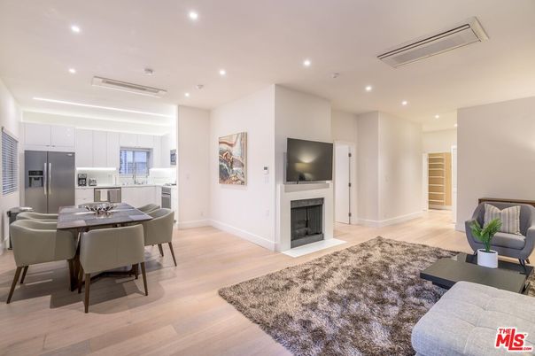 Dining room, Fireplace, Interior, Kitchen, Living room, Recessed Lighting, Stainless Steel Appliances, Wood Texture Flooring