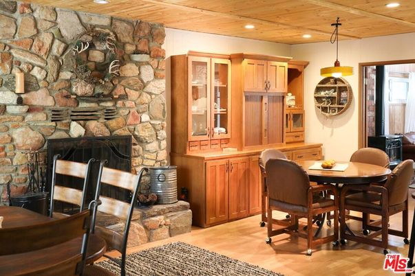 Dining room, Fireplace, Interior, Pendant Lights, Recessed Lighting, Stone Walls, Wooden Ceilings, Wood Texture Flooring