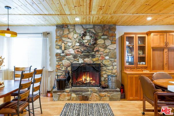 Dining room, Fireplace, Interior, Pendant Lights, Recessed Lighting, Stone Walls, Wooden Ceilings, Wood Texture Flooring