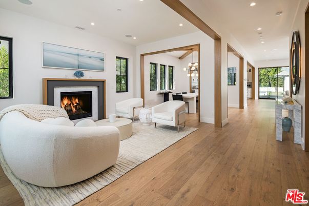 Chandelier, Dining room, Fireplace, Interior, Living room, Pendant Lights, Recessed Lighting, Wood Texture Flooring